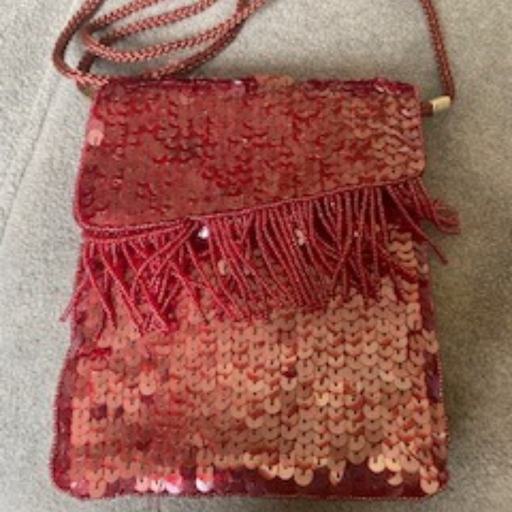 Should strap bag with shoulder strap and belt loop on leather back.